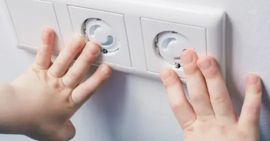Wall socket with safety plugs
